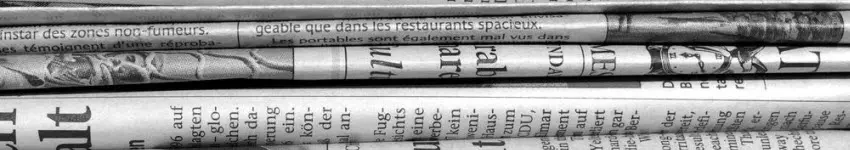 stack of newspapersFI