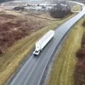 Autonomous tractor pulling a trailer down a highway