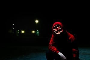 A menacing looking hacker causing cyber-security issues in supply chains