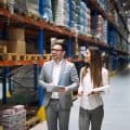 Two people walking in a warehouse